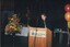 Robert Menzies reads from the podium