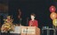 Lise Rodgers reads from the podium
