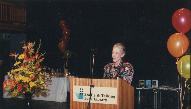 Unknown narrator presenting from the podium