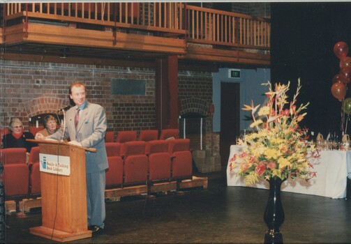Unknown male presenting from the podium