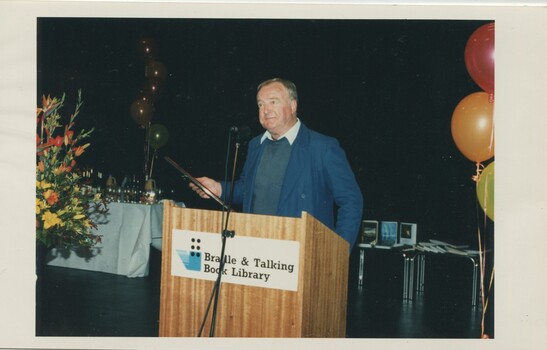 Jeffrey Hodgson accepting an award at the podium