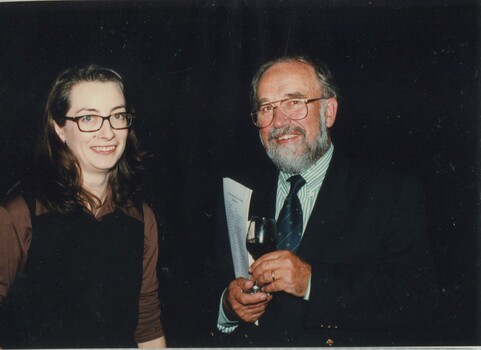 Unknown man speaking with Rae Foster