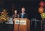 Robert Dessaix and unknown woman at podium