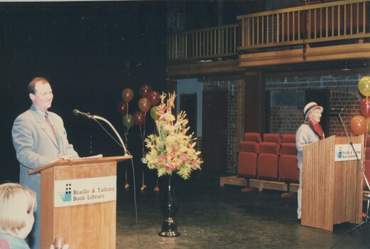 Two people at podium during the event