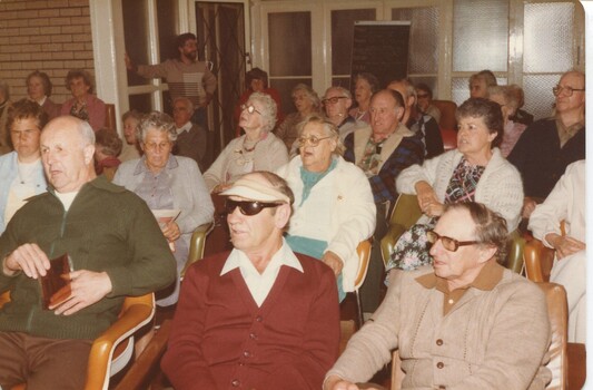 Group singing in a hall on holiday