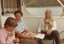 Peg and Bryan Sitlington on a boat with John Kunek