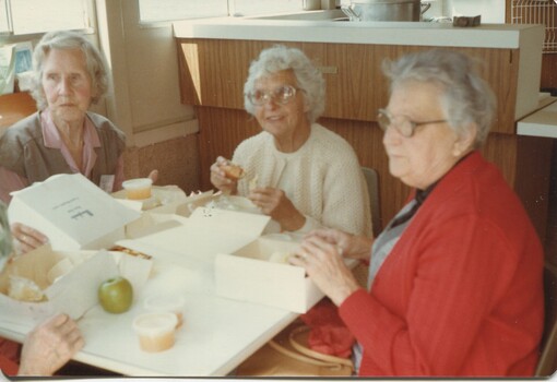 Unknown lady, Elsie Black and May Maddern enjoying packed lunch