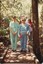 Two women stop on a small bridge during a bushwalk