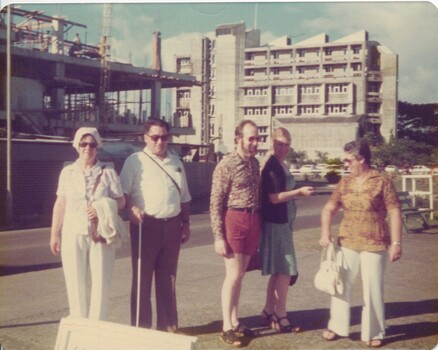 Group of people near building site possibly in Suva
