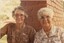 Two woman smile towards the camera