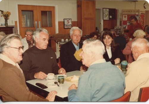Group of people eating lunch in the Day Centre