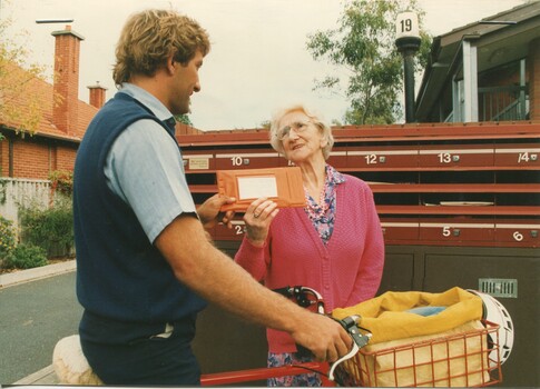 Merle Hardham receives books from Australia Post