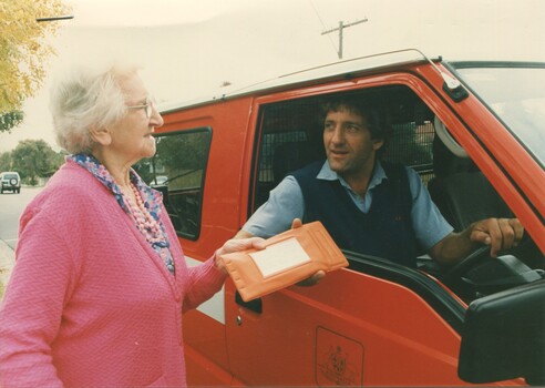 Merle Hardham receives books from Australia Post