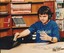 Child wearing headphones listening to a cassette player