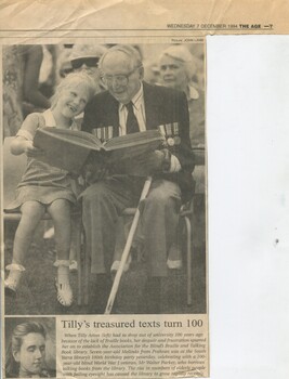 Schoolgirl holding Braille book with 100 year old man