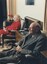 Edith and Jim listening to cassettes on their audio player in their lounge room