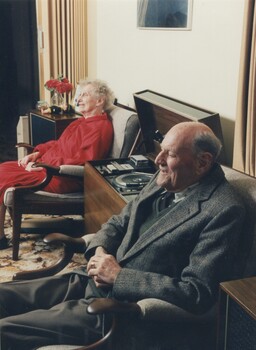 Edith and Jim listening to cassettes on their audio player in their lounge room
