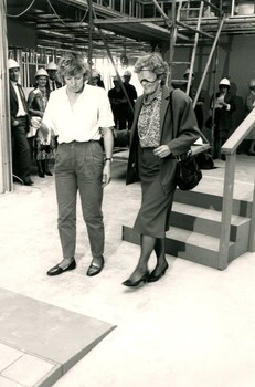 Blindfolded Hazel Hawke is accompanied by a mobility instructor as she walks towards another obstacle