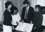 Murray Mountain and Shirley Admans looks at Proclamation with two women