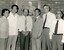 Chinese vistors, Barry Furness and John Cook stand in front of George Vowell portrait