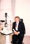 Rob Knowles sits in client chair at eye examination station