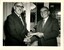 Hugh Robertson hands a cheque to Bruce Small