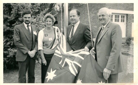 Ian Moore, Diana Jones, Roger Shipton and older male with Australian flag