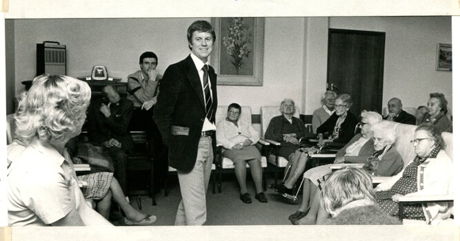 Mal Walden speaking to a group of residents