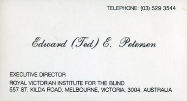 White business card with black writing
