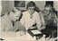 Terry Fraser with two men operating a CB radio