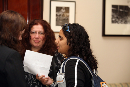Maysa Abouzeid speaking with other guests