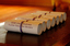 Table with 7 rolled certificates to be presented