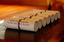 Table with 7 rolled certificates to be presented