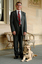 Kevin Murfitt with his dog guide at Government House