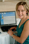 Prue Watt with her hands on a computer keyboard