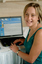 Prue Watt with her hands on a computer keyboard