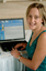 Prue Watt with her hands on a computer keyboard