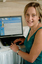 Prue Watt with her hands on a computer keyboard