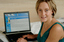 Prue Watt with her hands on a computer keyboard