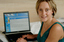 Prue Watt with her hands on a computer keyboard