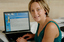 Prue Watt with her hands on a computer keyboard
