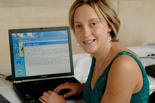 Prue Watt with her hands on a computer keyboard