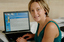Prue Watt with her hands on a computer keyboard