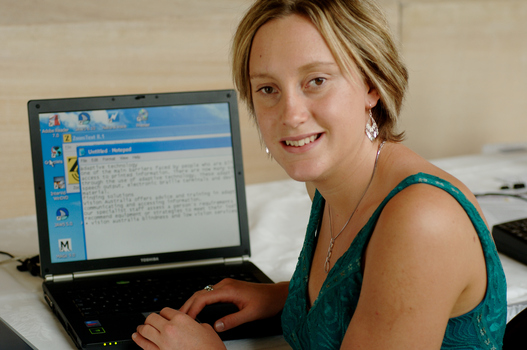 Prue Watt with her hands on a computer keyboard