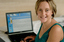 Prue Watt with her hands on a computer keyboard
