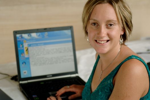 Prue Watt with her hands on a computer keyboard