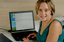 Prue Watt with her hands on a computer keyboard