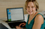 Prue Watt with her hands on a computer keyboard