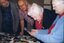 Rhonda Peters, Ian Mills, Connie Pigdon and Eleanor McDonald look at images