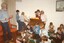 Primary school children playing musical instruments in nursing home